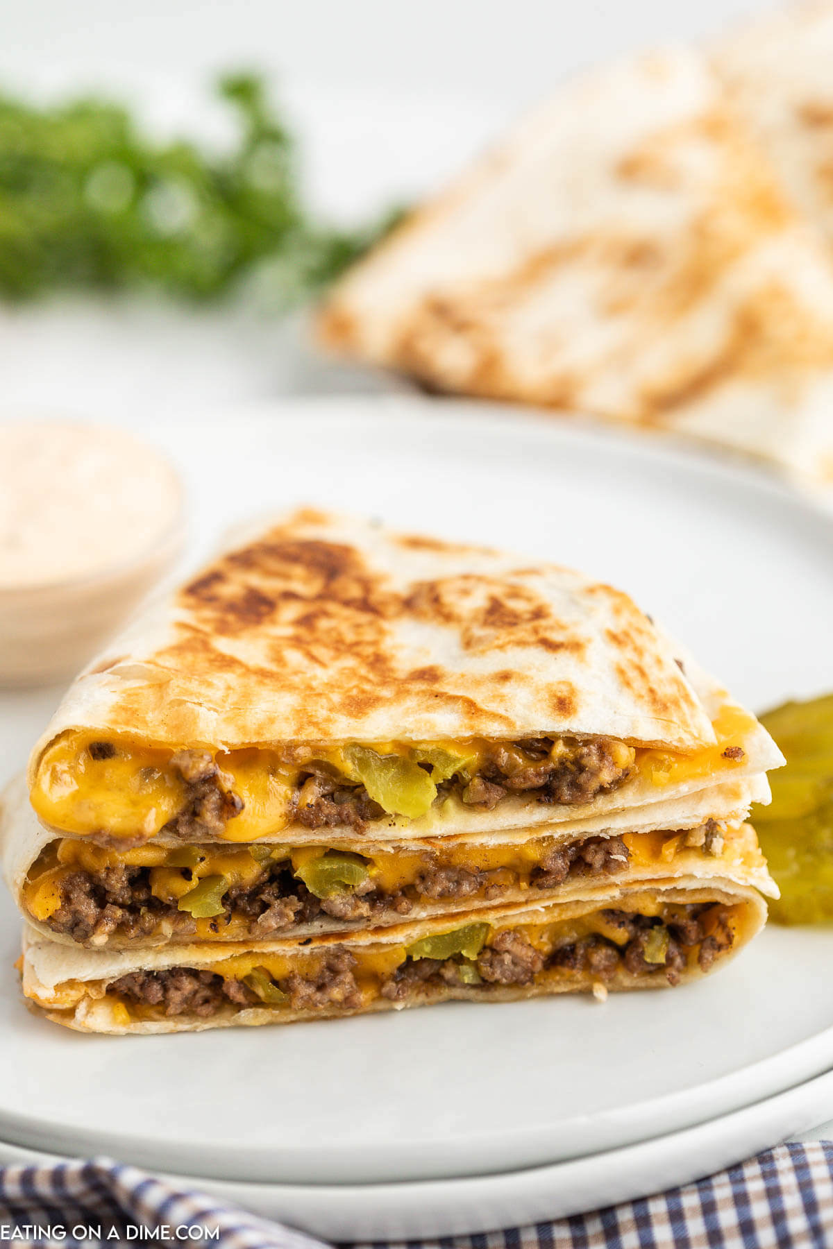 Cheeseburger Quesadilla stacked on a plate