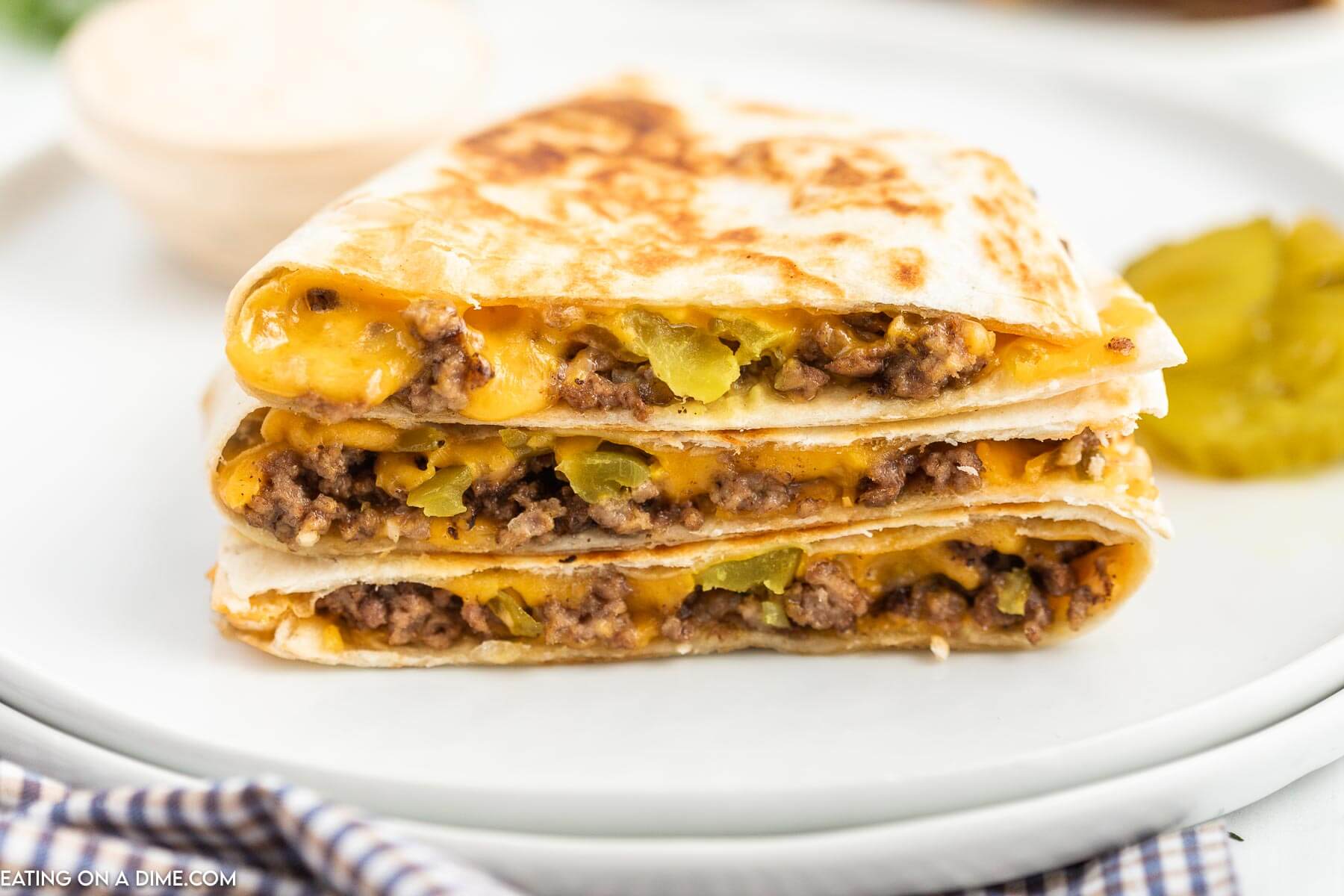 Cheeseburger Quesadilla stacked on a plate