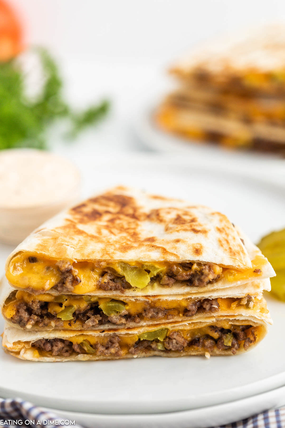 Cheeseburger Quesadilla stacked on a plate