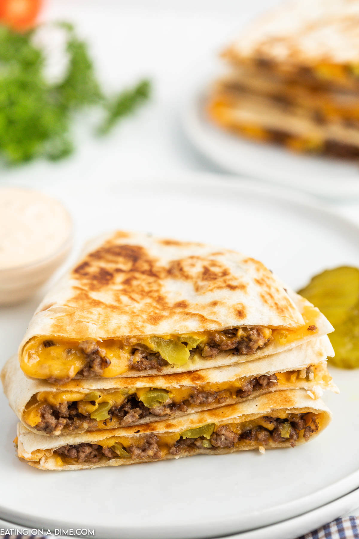 Cheeseburger Quesadilla stacked on a plate