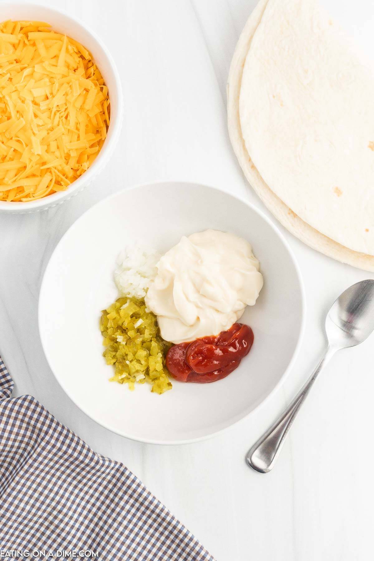 Adding sauce ingredients to a bowl