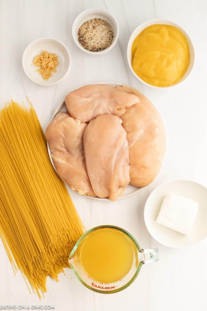Ingredients needed - chicken breast, italian dressing mix, minced garlic, cream of chicken soup, chicken soup, cream cheese, angel hair pasta