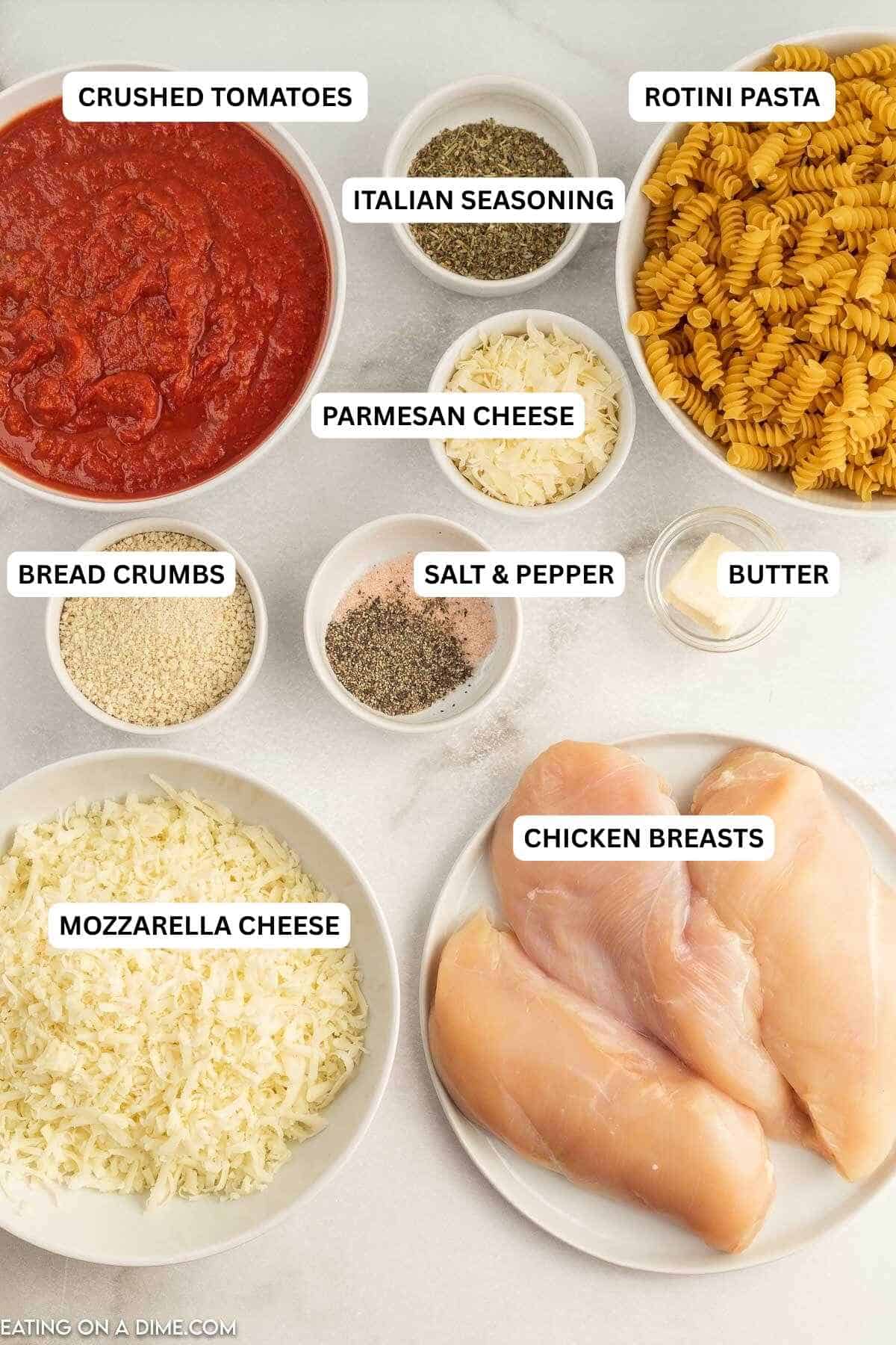Ingredients for recipe: crushed tomatoes, Italian seasoning, pasta, Parmesan cheese, butter, salt, pepper, breadcrumbs, mozzarella cheese and chicken breasts.