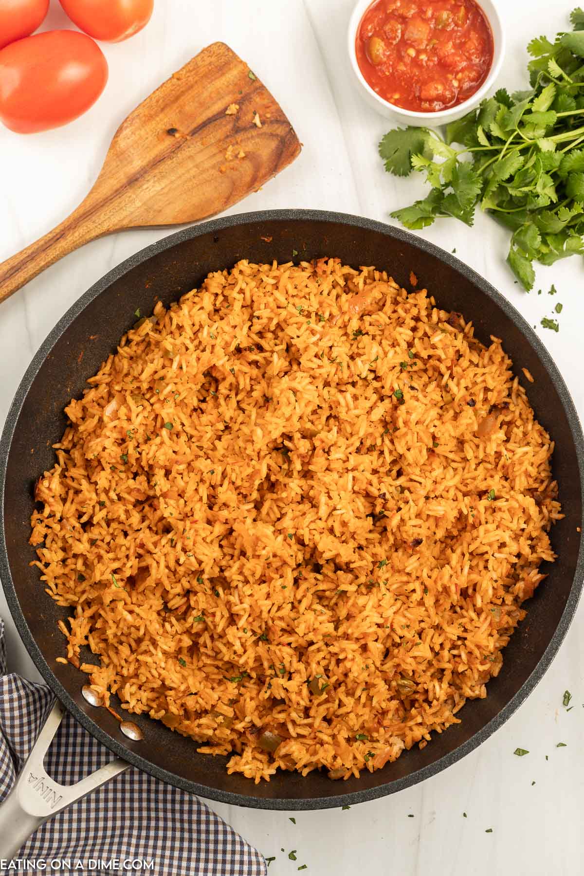 The liquid is the skillet has been absorbed by the rice and the Spanish Rice is ready in the skillet to be enjoyed. 