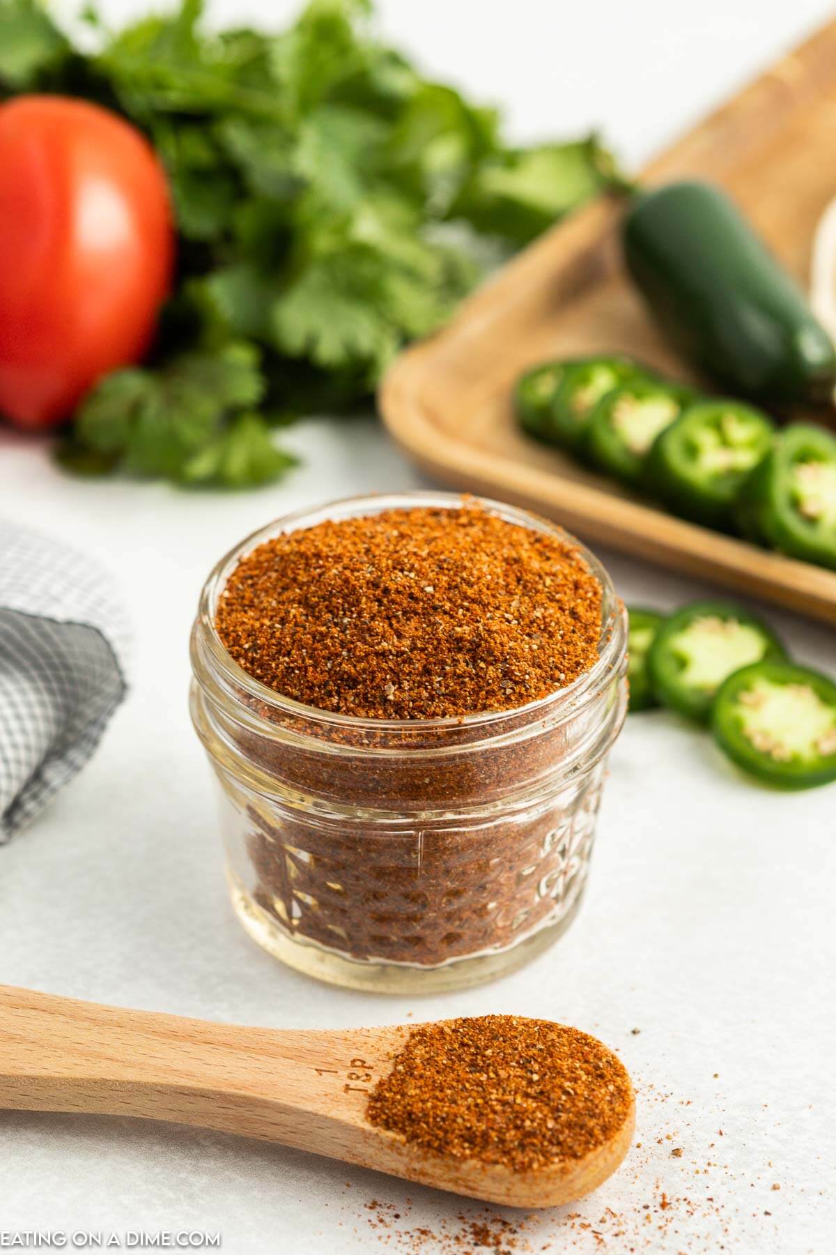 This delicious Homemade Taco Seasoning recipe is so easy to make. You will save a ton of money by making this. Learn how to make homemade taco seasoning. Taco Seasoning in a jar with a teaspoon