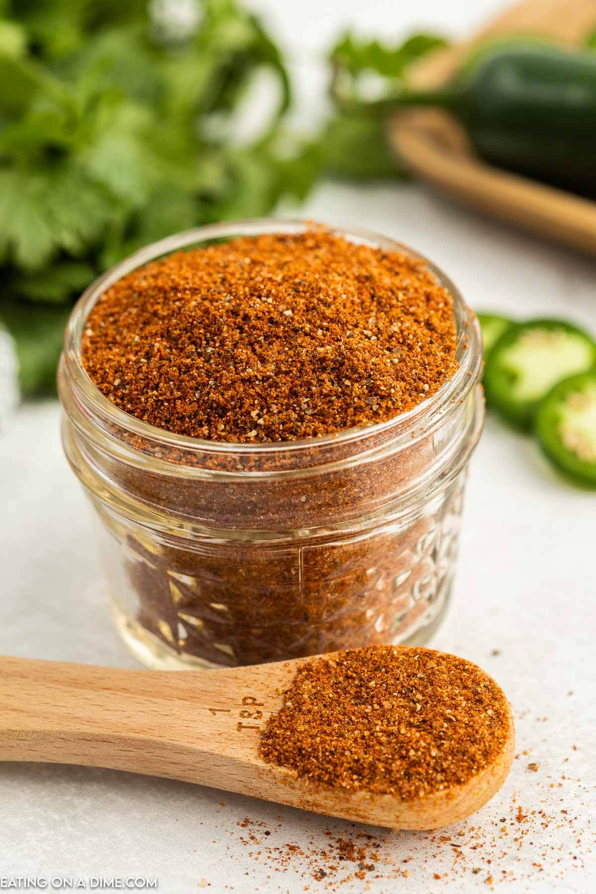 This delicious Homemade Taco Seasoning recipe is so easy to make. You will save a ton of money by making this. Learn how to make homemade taco seasoning. Taco Seasoning in a jar with a teaspoon