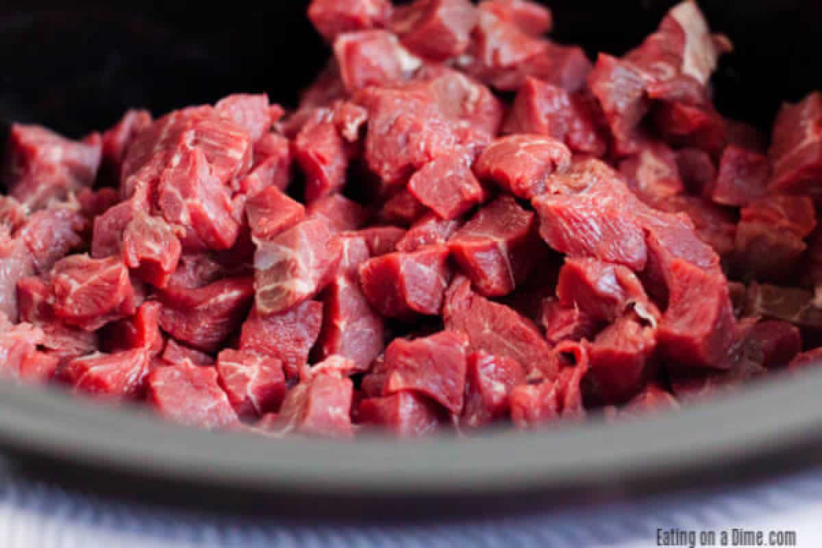 Crock Pot Beef Gyros Recipe makes dinner time a breeze. The tender beef paired with the delicious tzatziki sauce makes this a meal your family will love. Placing the beef in the slow cooker.