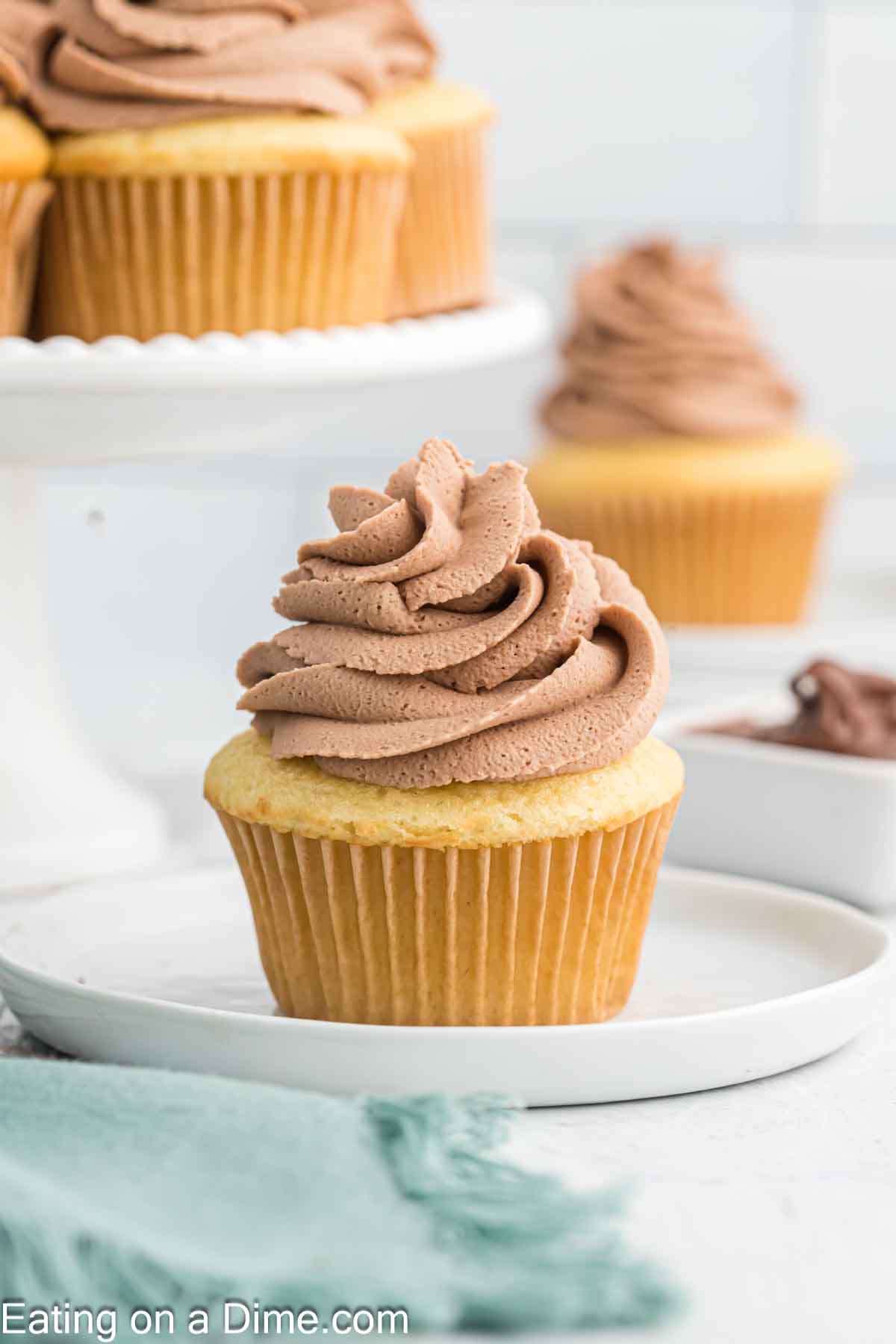 Cupcake on a plate topped with Nutella Frosting