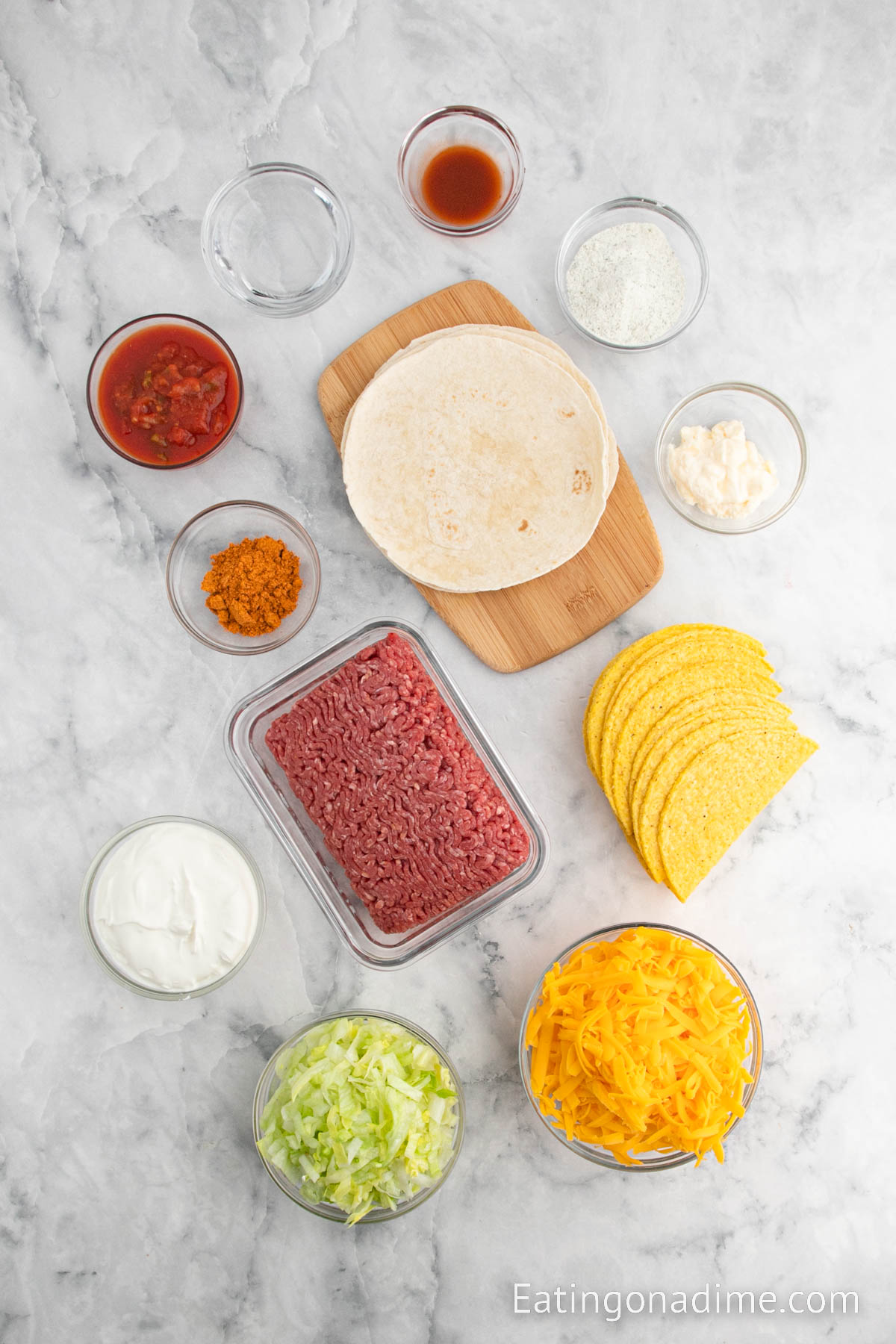 Ingredients needed for Taco Bell Cheesy Gordita Crunch - Ground Beef, taco seasoning, salsa, water, taco shells, cheese, flour tortillas, lettuce, sour cream, ranch seasoning mix, mayonnaise, hot sauce