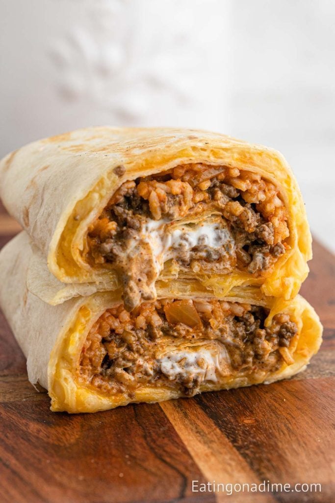 Taco Bell Quesarito cut in half stacked on a plate