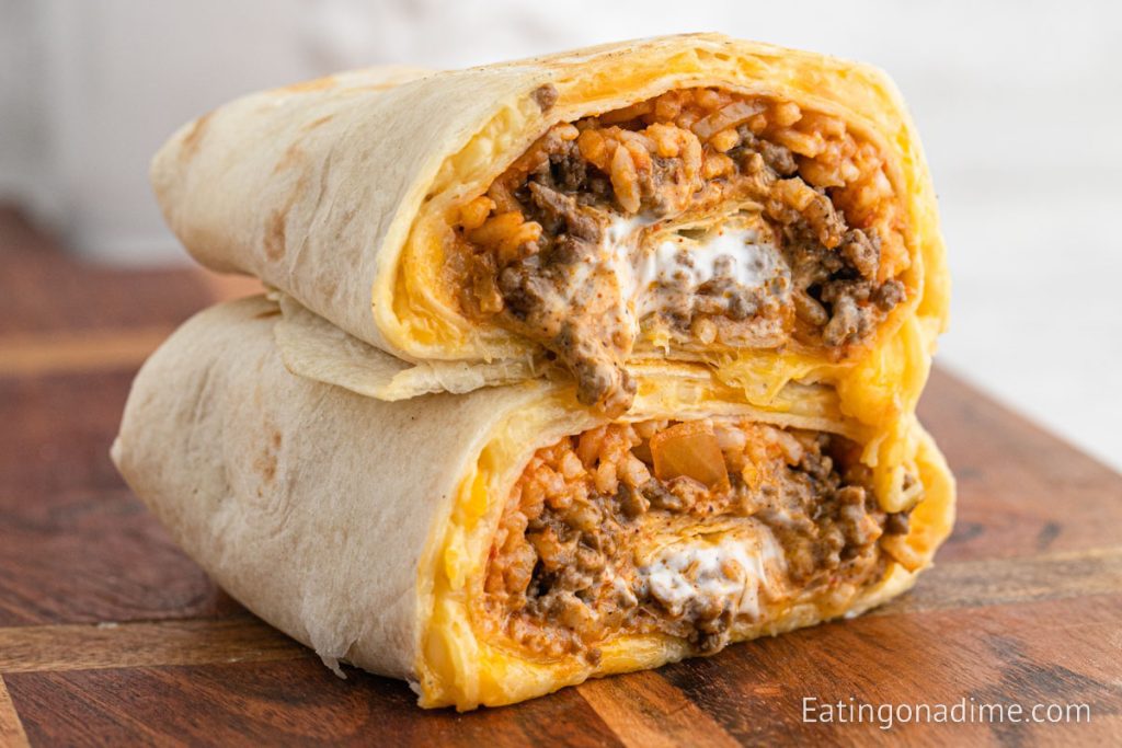 Taco Bell Quesarito cut in half stacked on a plate
