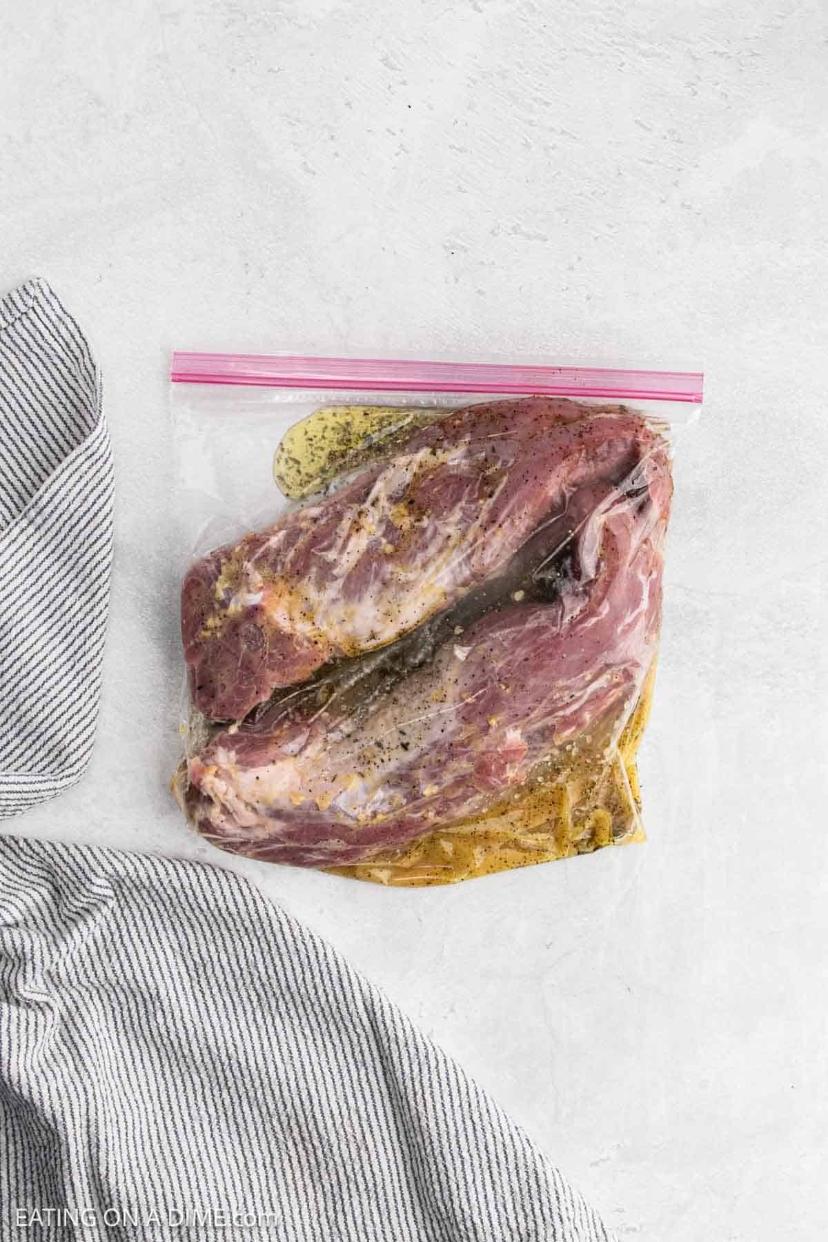 Pork tenderloin and marinade in a zip lock bag.