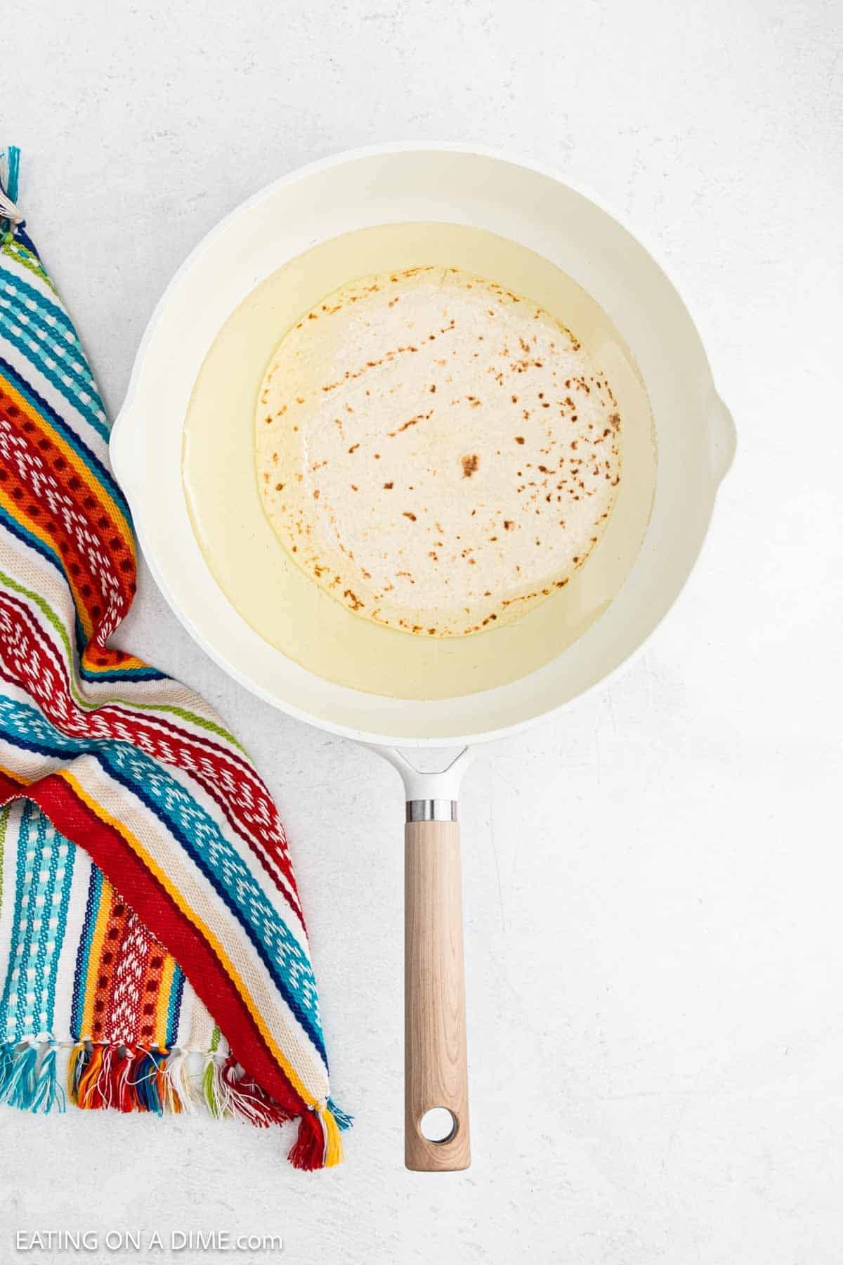Flour tortilla in oil in a large skillet.