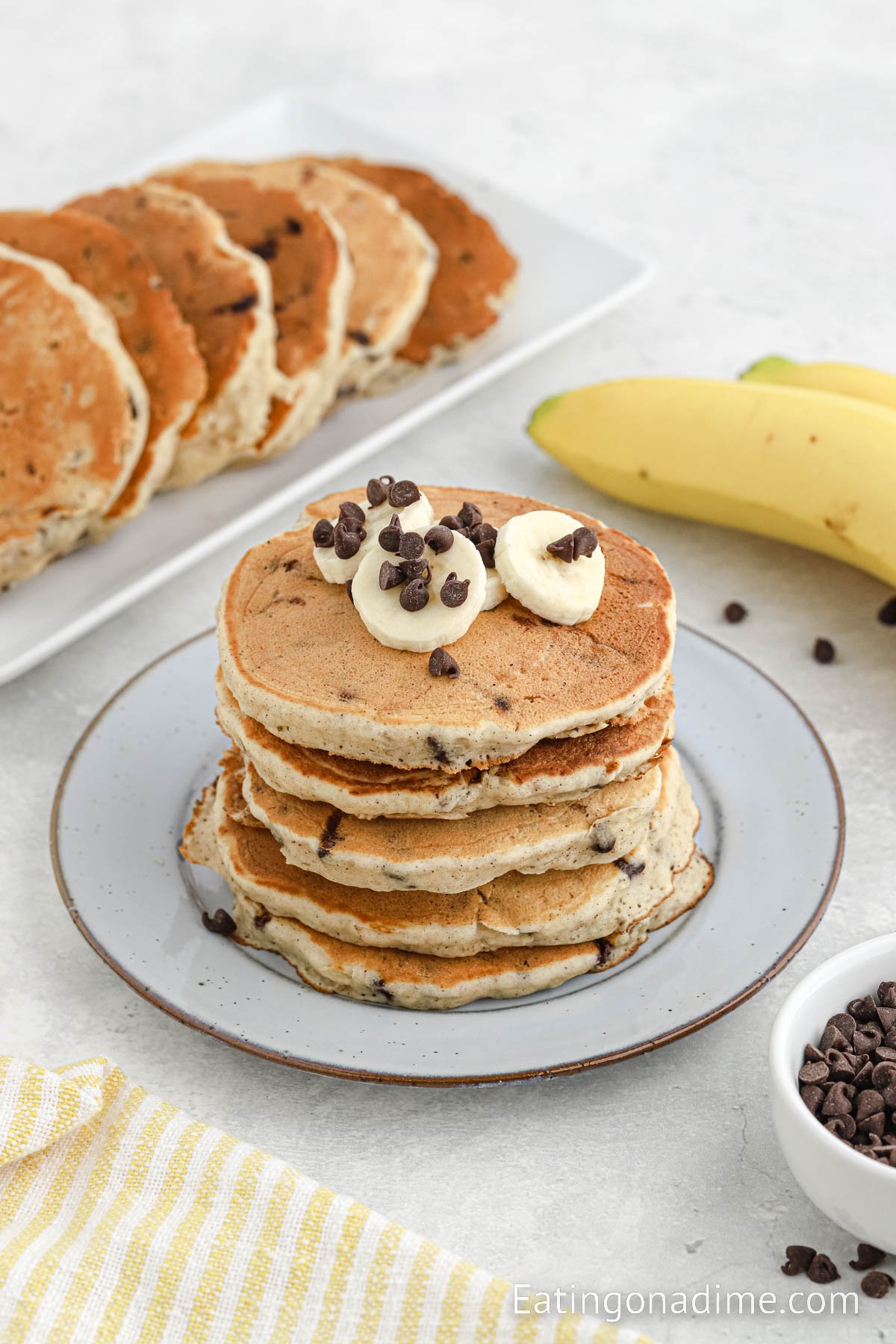 Stacked Banana Chocolate Chip Pancakes on a plate