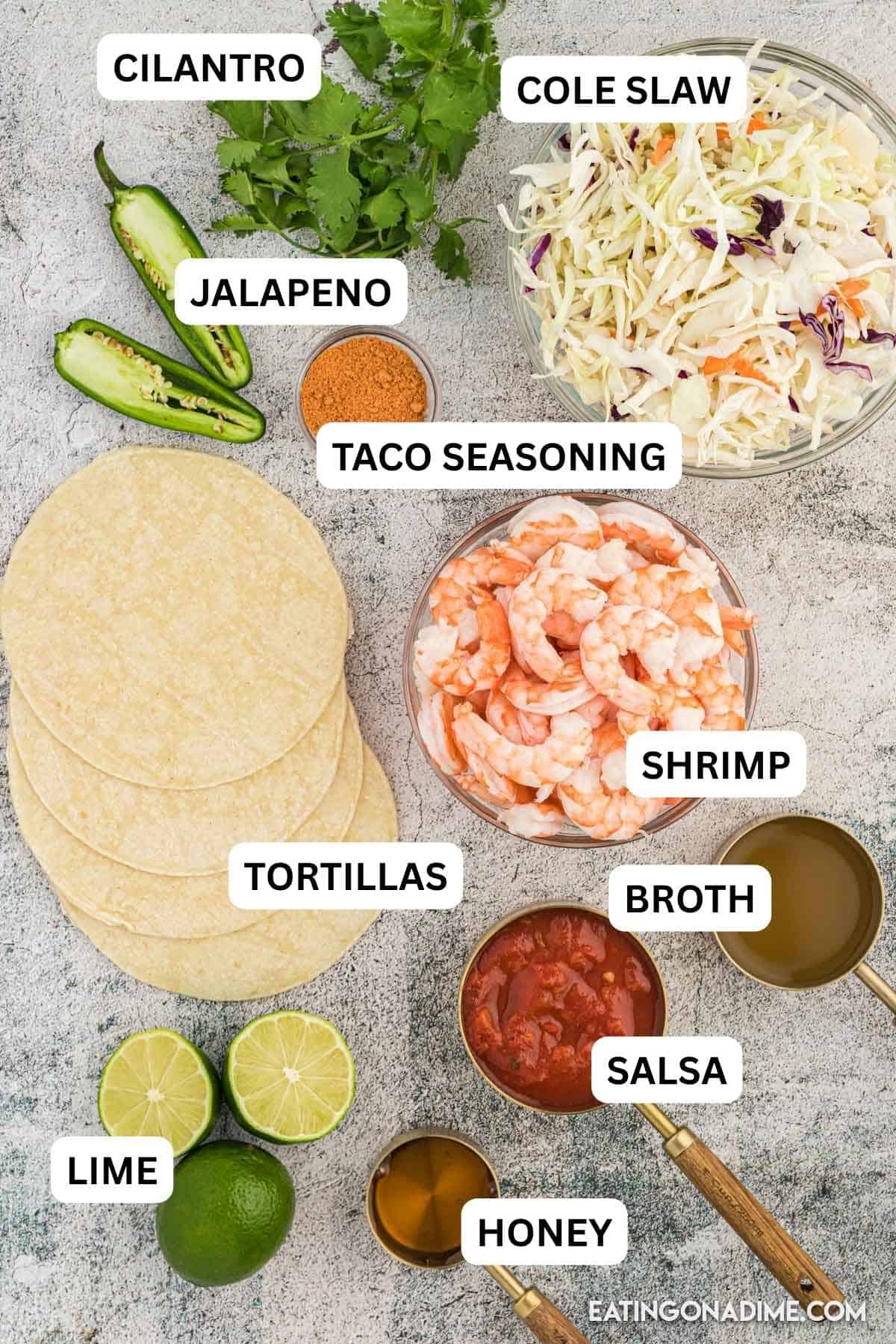 The entire family will love this quick and easy shrimp tacos recipes. Everything is easily prepared in under 5 minutes in a skillet and is healthy. Ingredients needed to make this recipe with text on the items. Showing precooked shrimp, taco seasoning, salsa, chicken broth, corn tortillas, cole slaw mix, jalapeno and more.