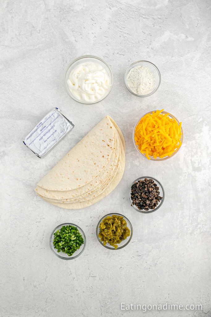 Ingredients needed - cream cheese, sour cream, ranch dressing mix, cheese, green chiles, olives, chopped green onions, flour tortilla