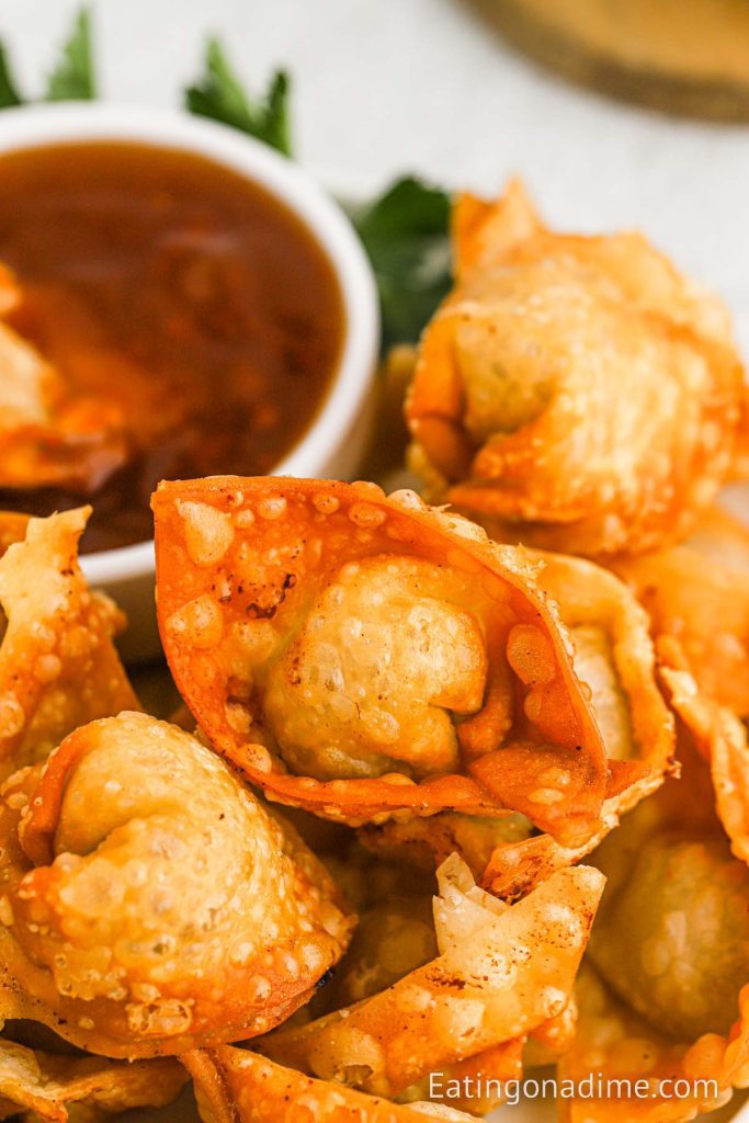 Fried wontons stacked on a platter