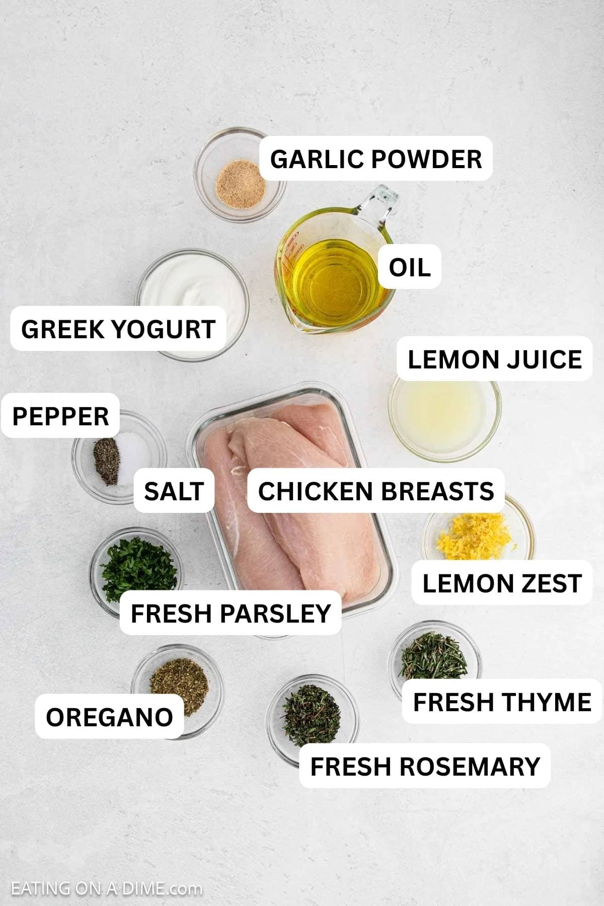 Ingredients needed to make this recipe includes chicken breasts, oil, greek yogurt, garlic powder, lemon, fresh thyme, dried oregano, fresh rosemary, fresh parsley, and salt and pepper.