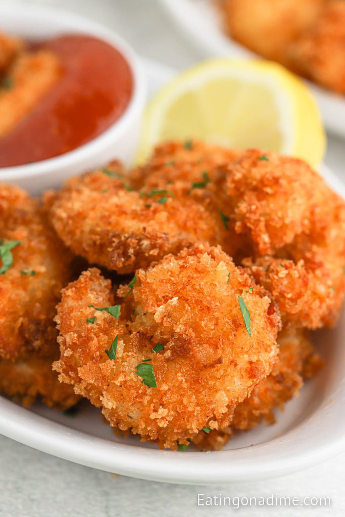 Panko Shrimp stacked on a plate