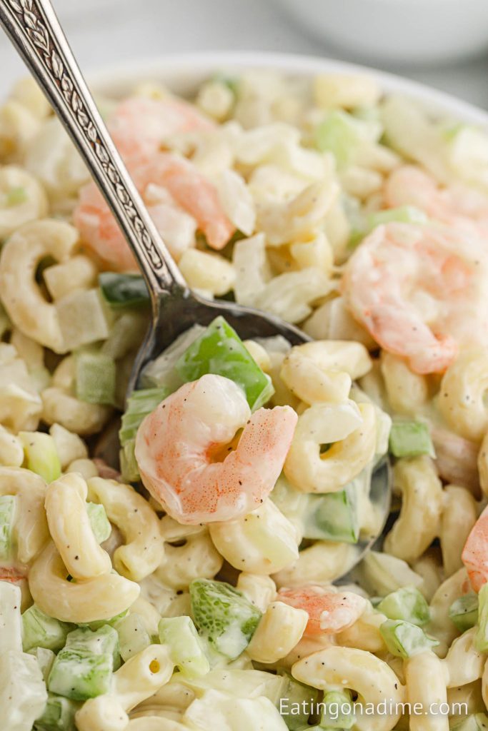 Close up Shrimp Macaroni Salad in a bowl with a spoon