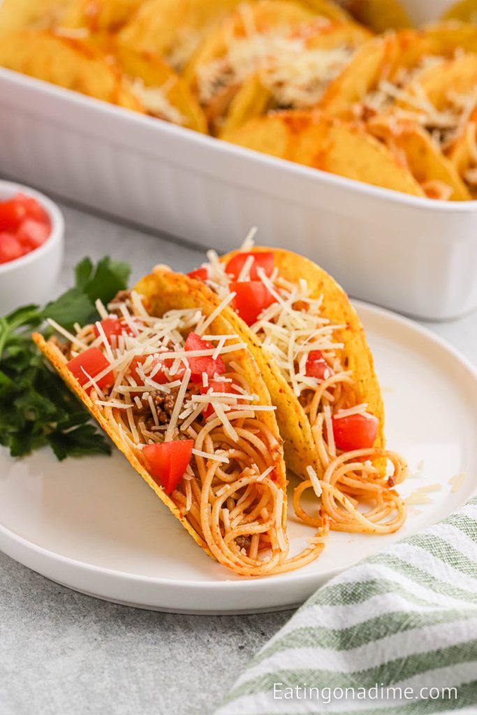 Two taco spaghetti on a plate