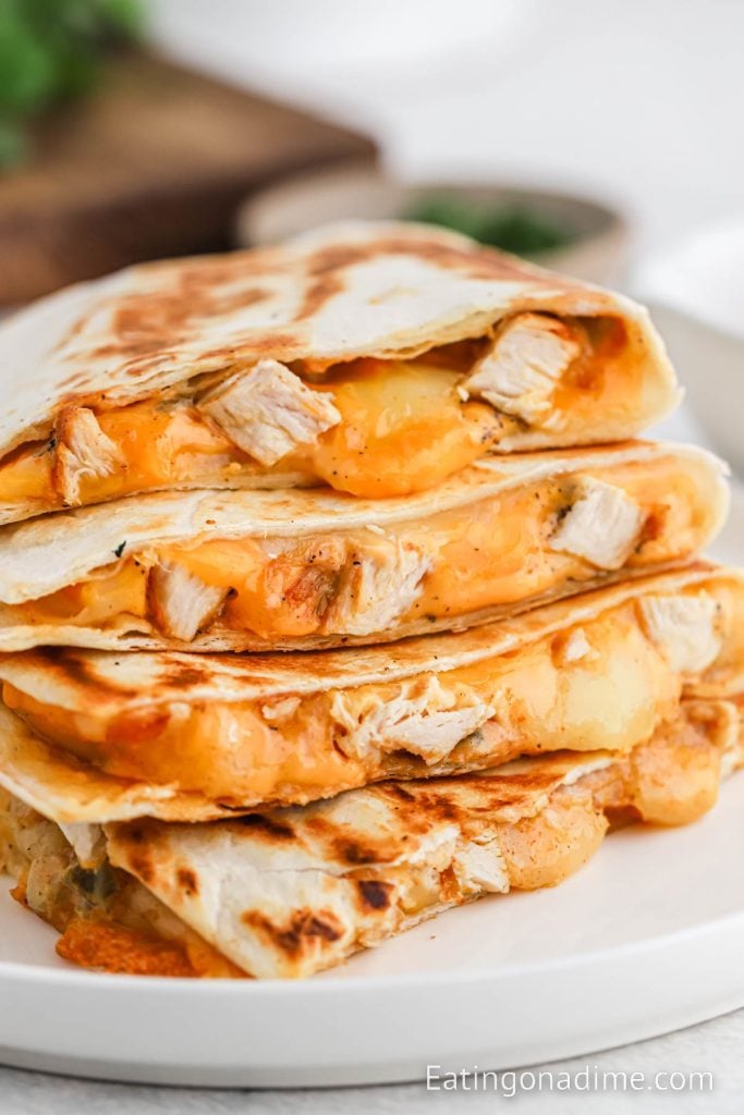 Chicken quesadilla stacked on a white plate