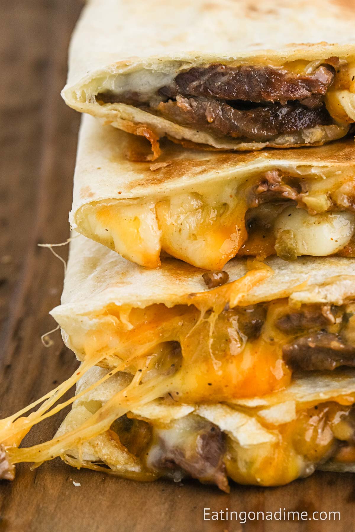 Steak Quesadilla sliced and stacked on a cutting board