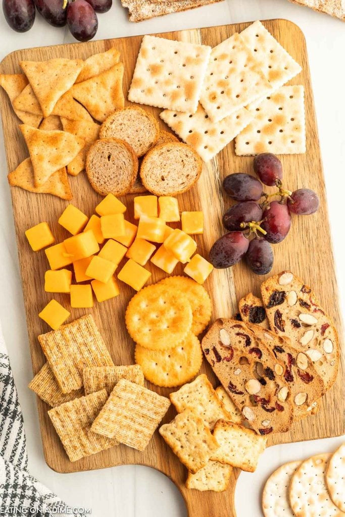 Charcuterie board with cheese, fruit and crackers
