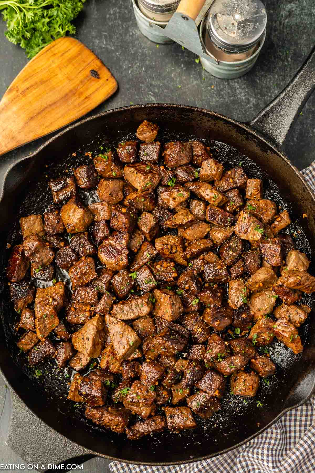 Garlic butter steak bites in a pan. 