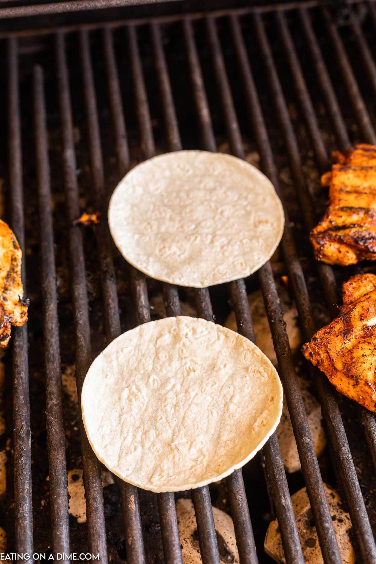 Tortillas on the grill being warmed. 