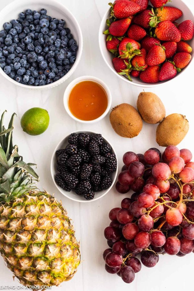 Ingredients needed - grapes, pineapple, strawberries, blueberries, blackberries, kiwi, lime, honey