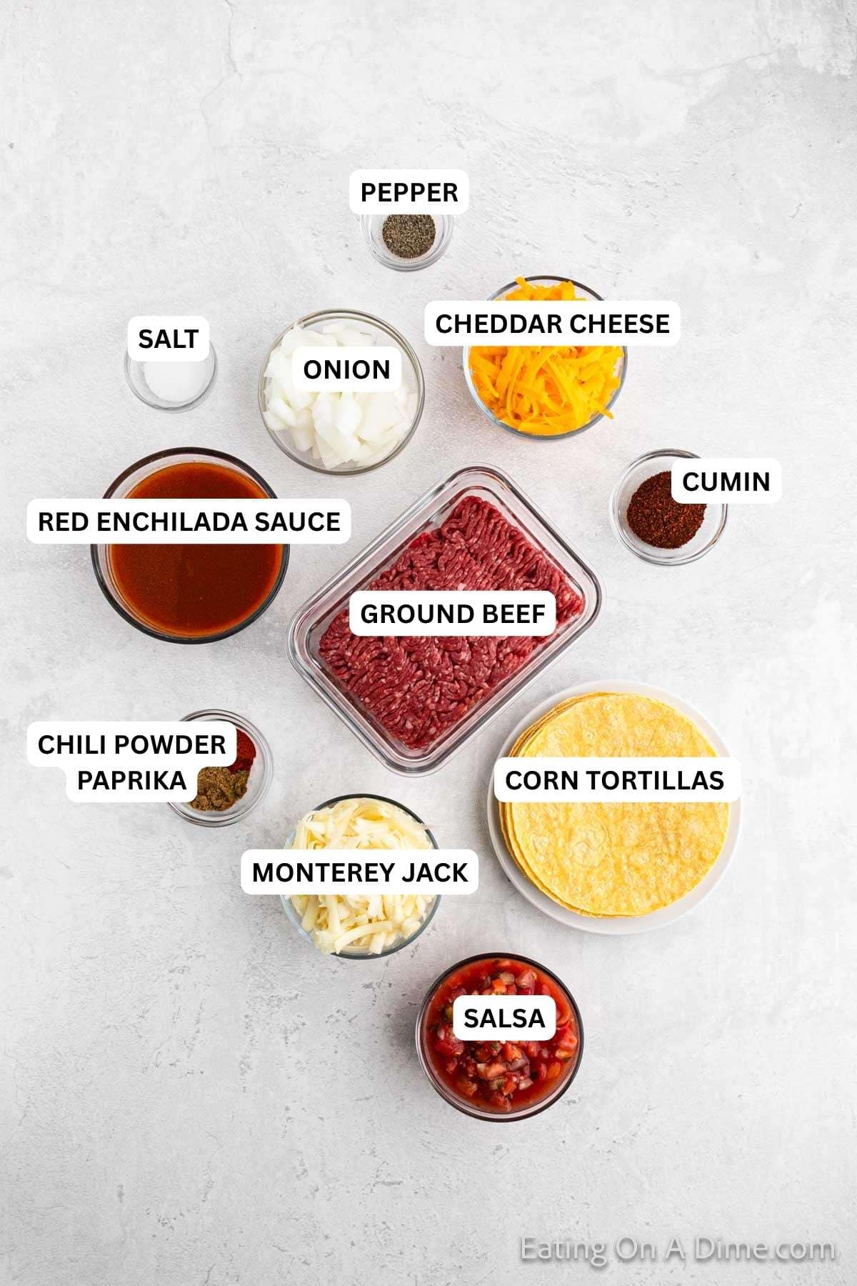 Ingredients for recipe: salsa, Monterey jack cheese, chili powder, paprika, ground beef, cumin, red enchilada sauce, cheddar cheese, onion, salt and pepper.