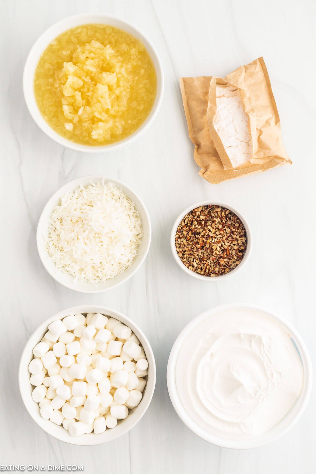 Ingredients needed - vanilla pudding mix, crushed pineapple, whipped topping, mini marshmallows, coconut, pecans