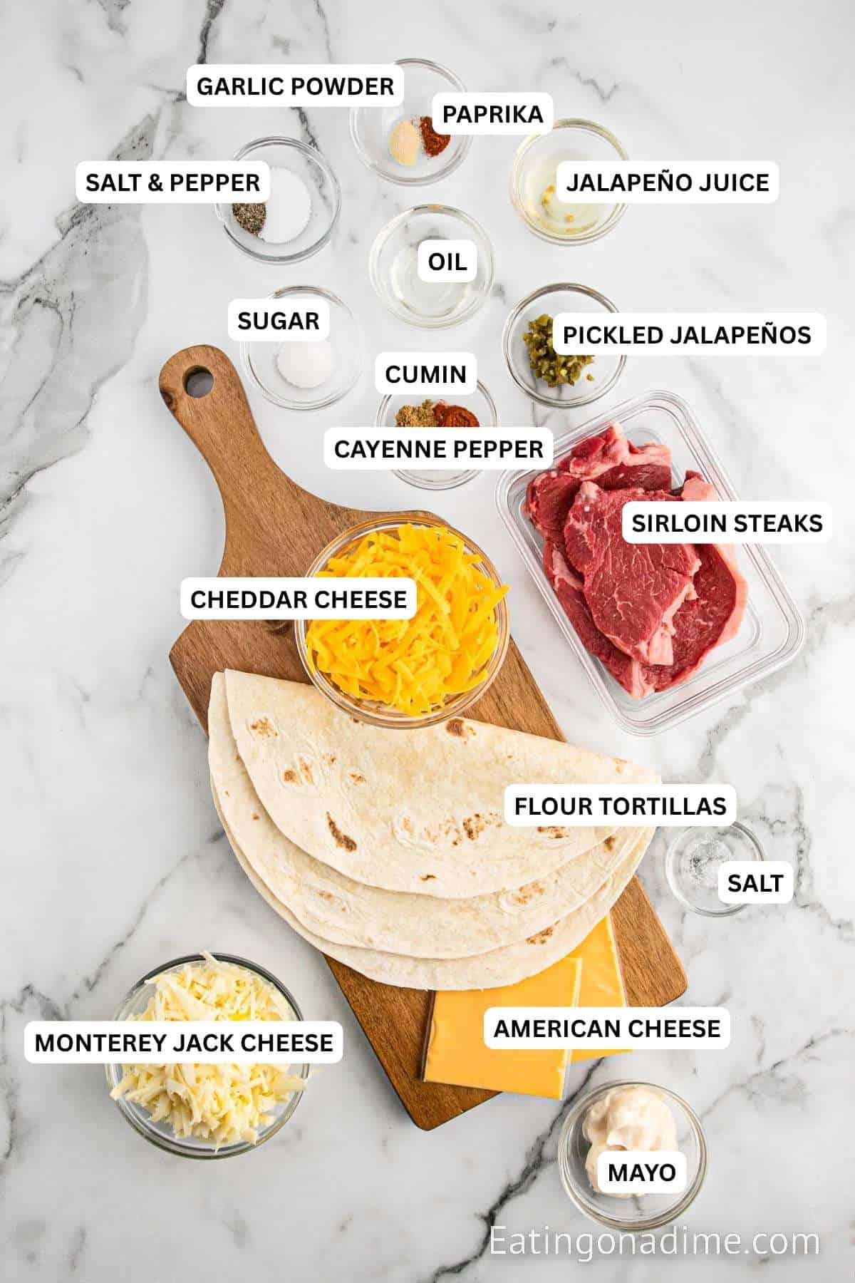 Ingredients for recipe: mayo, cheese, tortillas, steak, cayenne pepper, cumin, sugar, oil, pickled jalapenos, oil, salt, pepper, paprika.