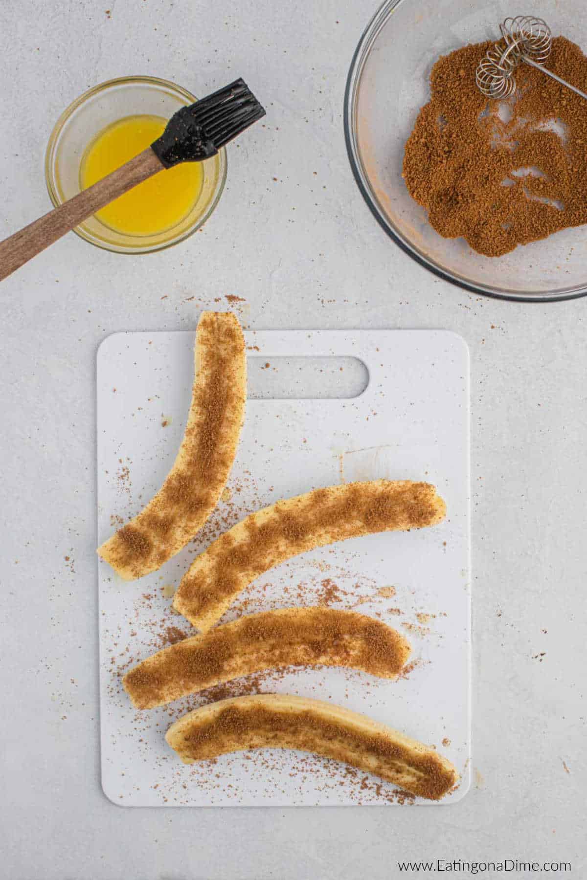Peeled and sliced bananas topped with cinnamon and sugar mixture.