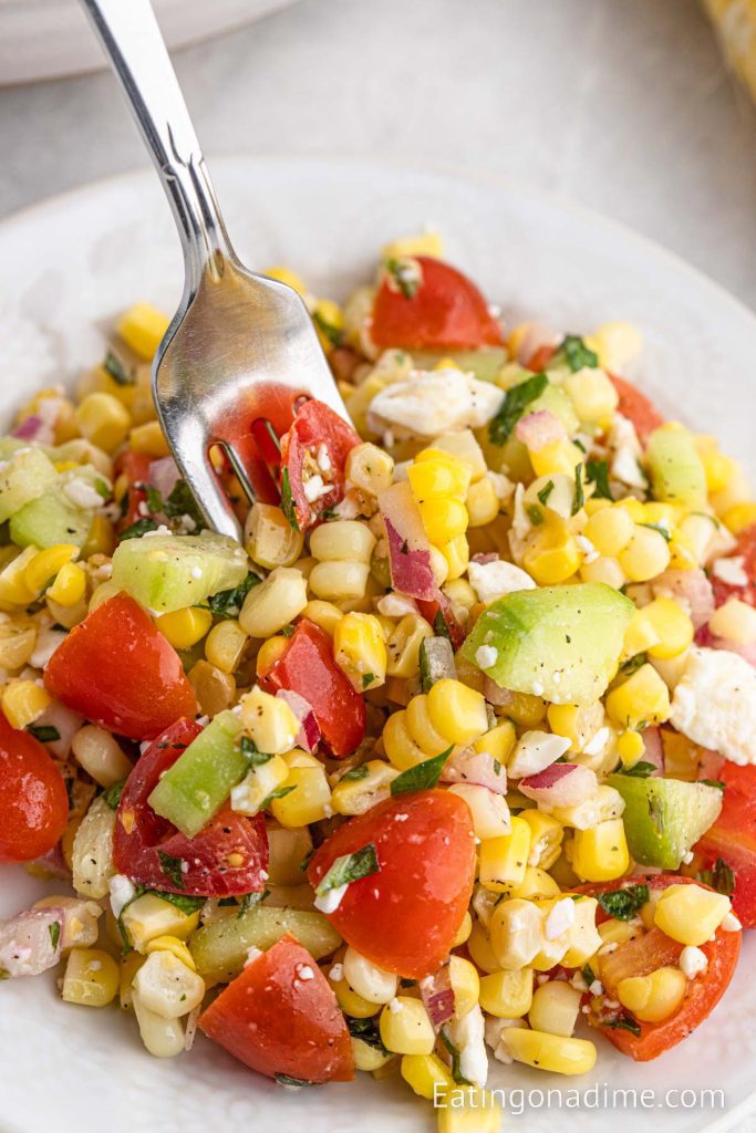 Corn Salad on a plate with a fork