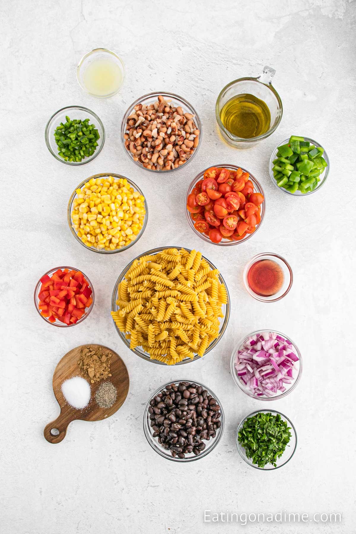 Ingredients needed Rotini pasta, cherry tomatoes, black beans, black eyed peas, corn, red onion, green bell pepper, red bell pepper, jalapeno pepper, fresh cilantro, olive oil, red wine vinegar, lime juice, cumin, salt, pepper