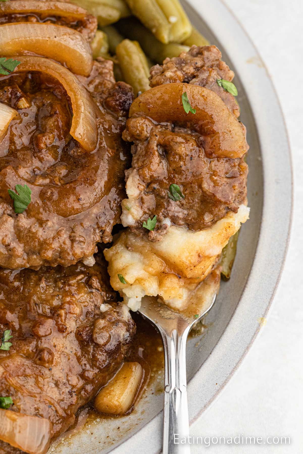 Cube Steak and gravy on a plate with mashed potatoes