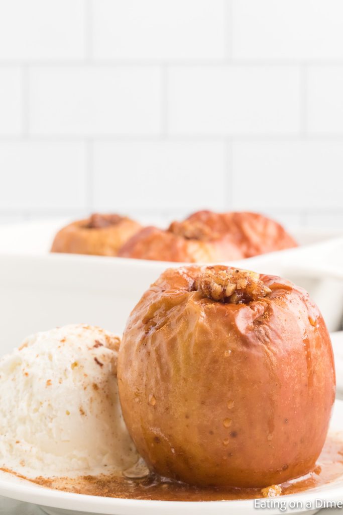 Baked Apple on a plate with a side of vanilla ice cream