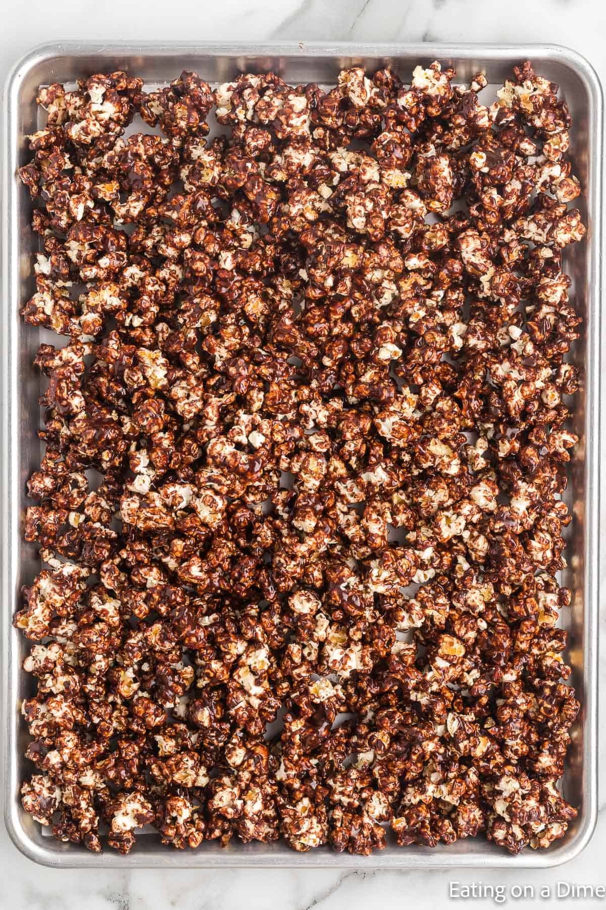 Chocolate popcorn on a baking sheet