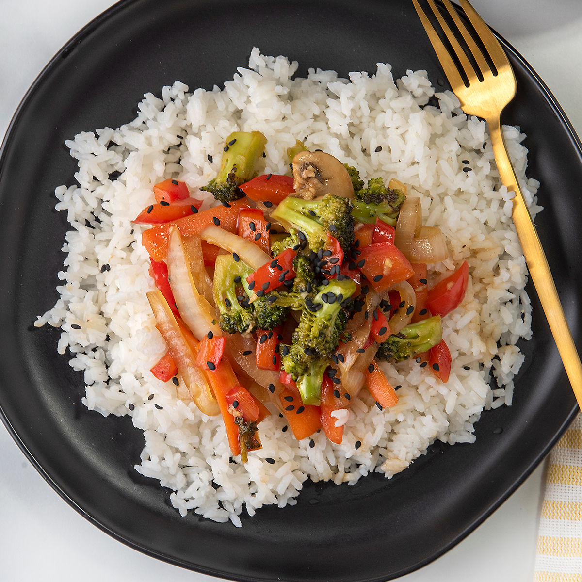 Teriyaki Vegetables on white rice on a plate