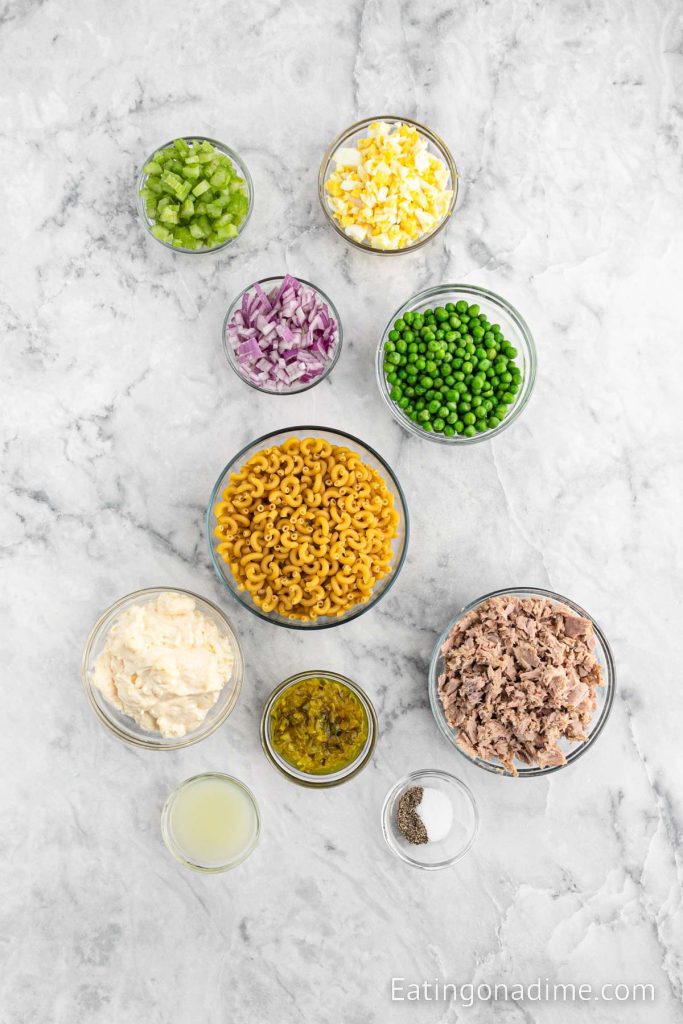 Ingredients needed - pasta, tuna, mayonnaise, ribs celery, red onion, relish, boiled eggs, salt and pepper, frozen peas, lemon
