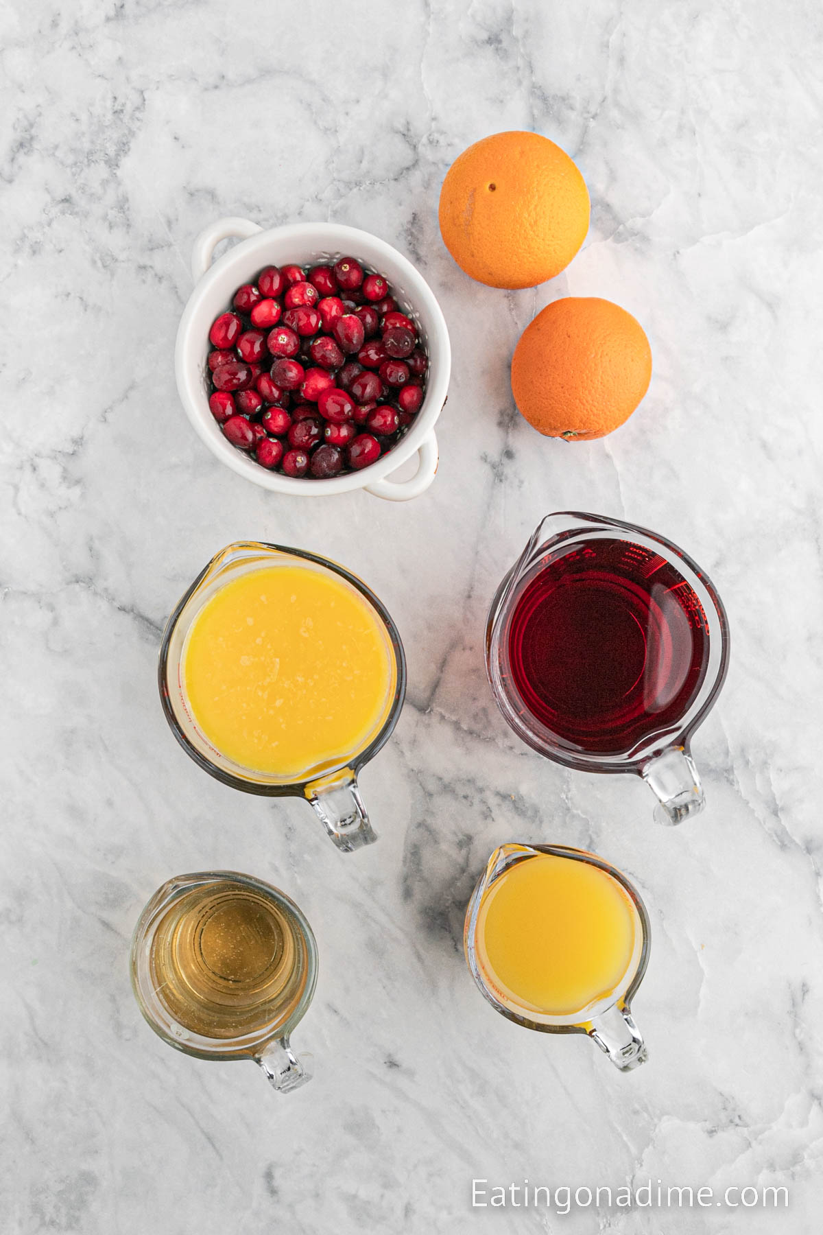 Ingredients needed - cranberry juice, orange juice, pineapple juice, ginger ale, cranberries, orange