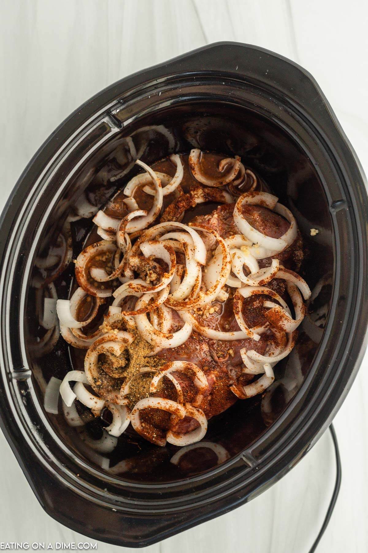 Adding the ingredients to the slow cooker