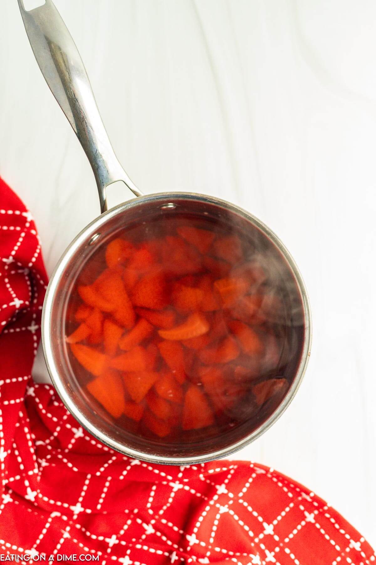 Strawberry mixture in a sauce pan. 