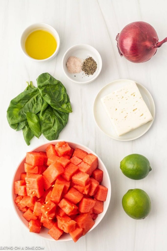 Ingredients needed - watermelon, basil leaves, feta cheese, red onion, olive oil, limes, salt and pepper