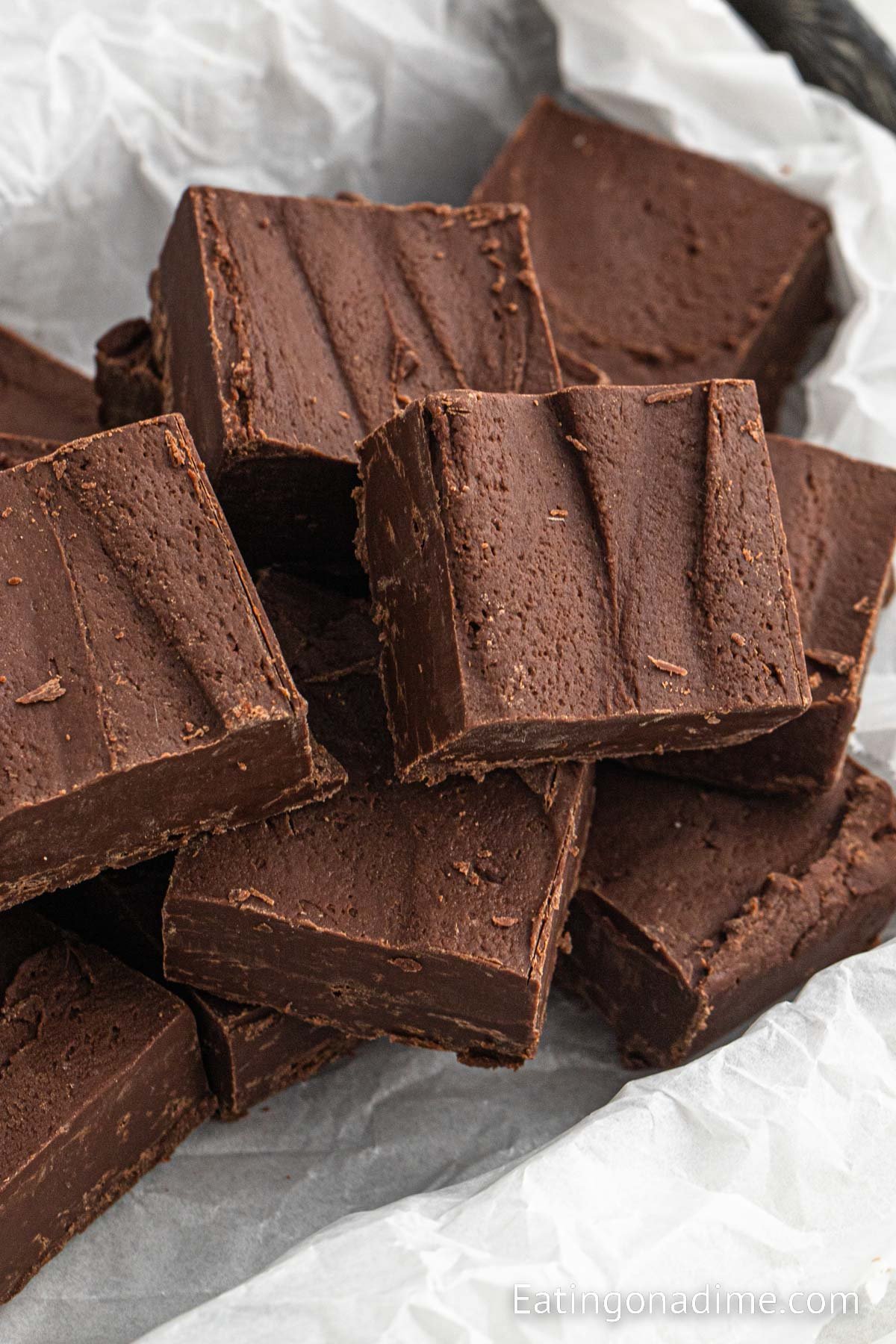 Chocolate fudge cut into squares and stacked