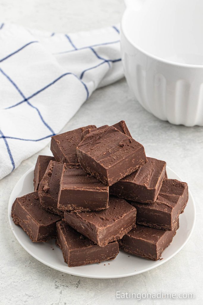 Chocolate fudge cut into squares and stacked