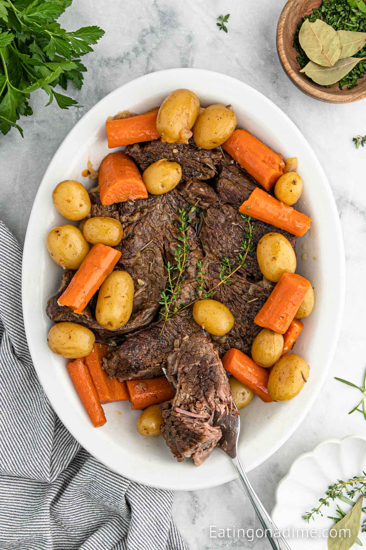 Pot roast, carrots, and potatoes on a platter