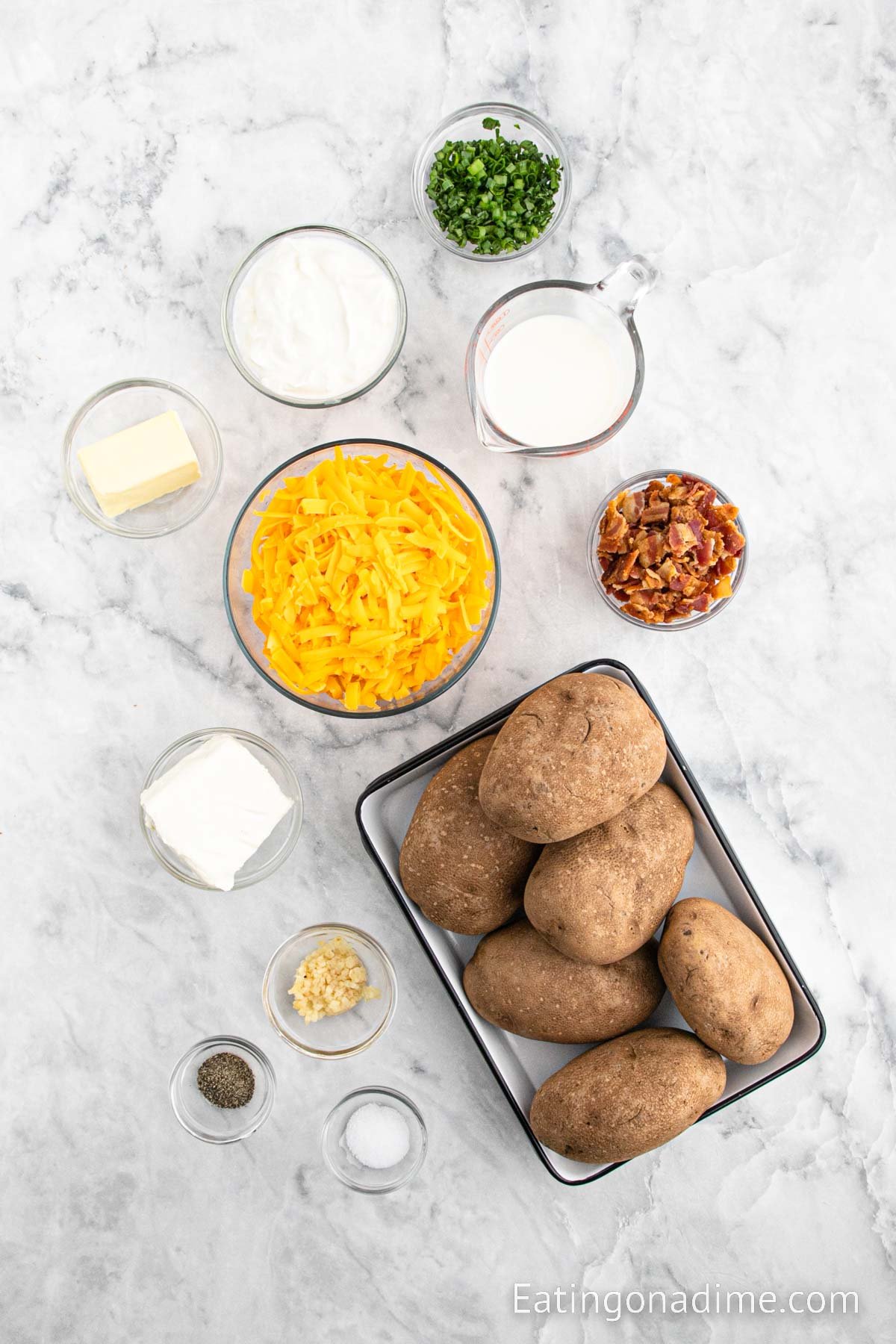 Ingredients - Russet Potatoes, minced garlic, cream cheese, sour cream, butter, milk, salt, pepper, bacon, cheese, green onions